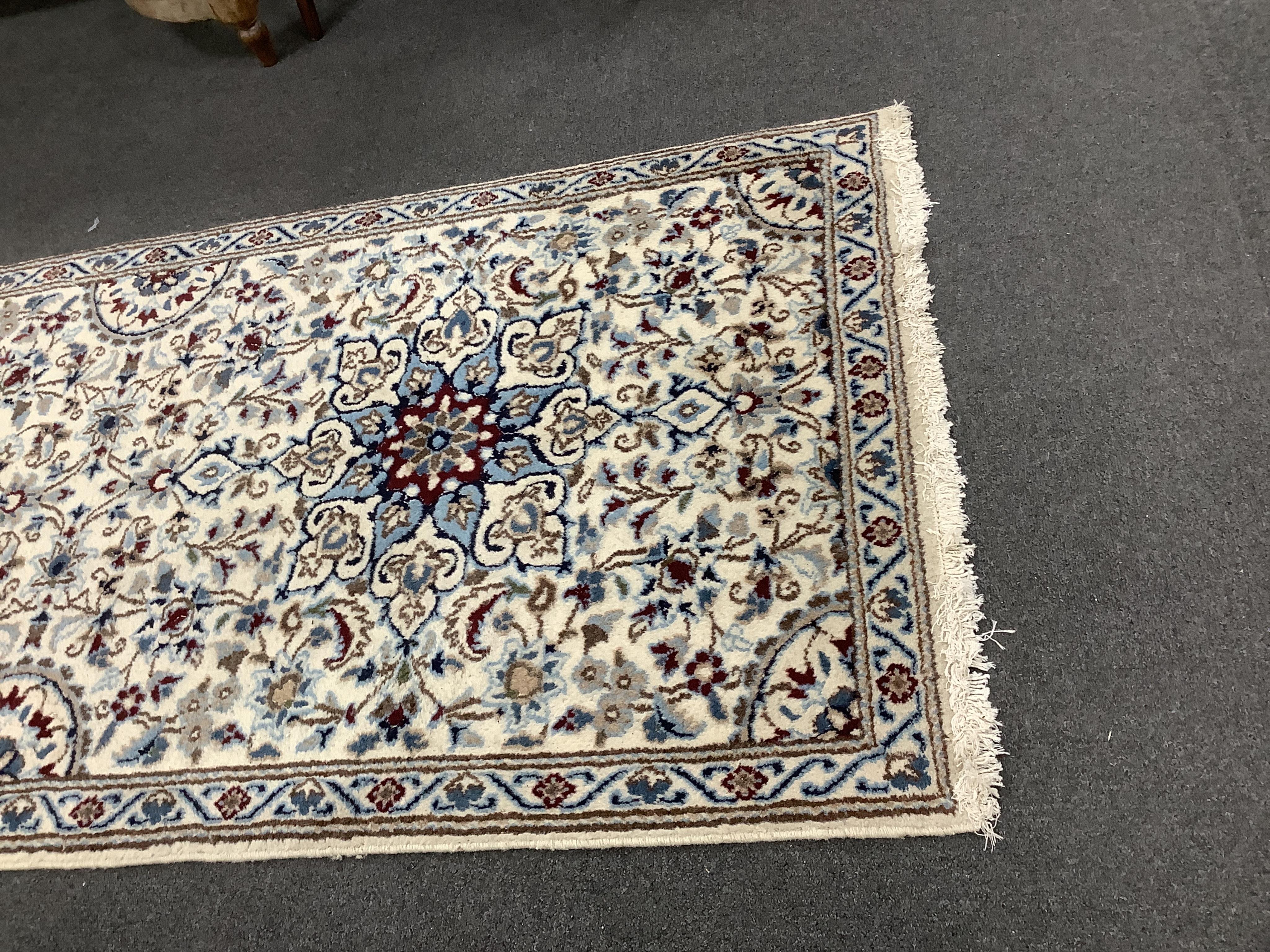 A Nain ivory ground runner, 386 x 86cm